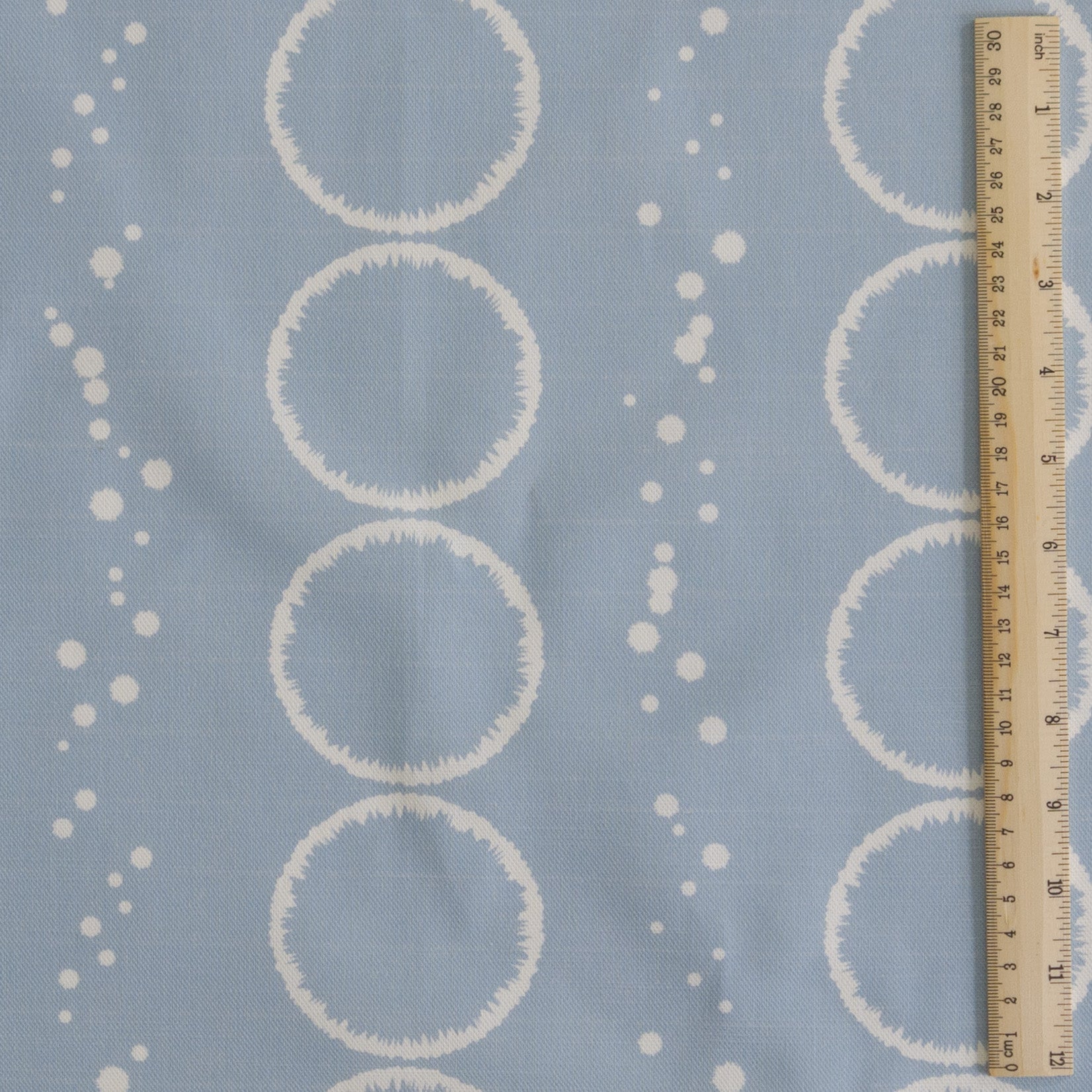 Splash Design in light blue grey printed onto white cotton linen for cushions curtains light upholstery and blinds shown in 30cm square