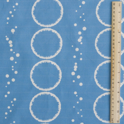 Splash Design in mid blue printed onto white cotton linen for cushions curtains light upholstery and blinds shown in 30cm square