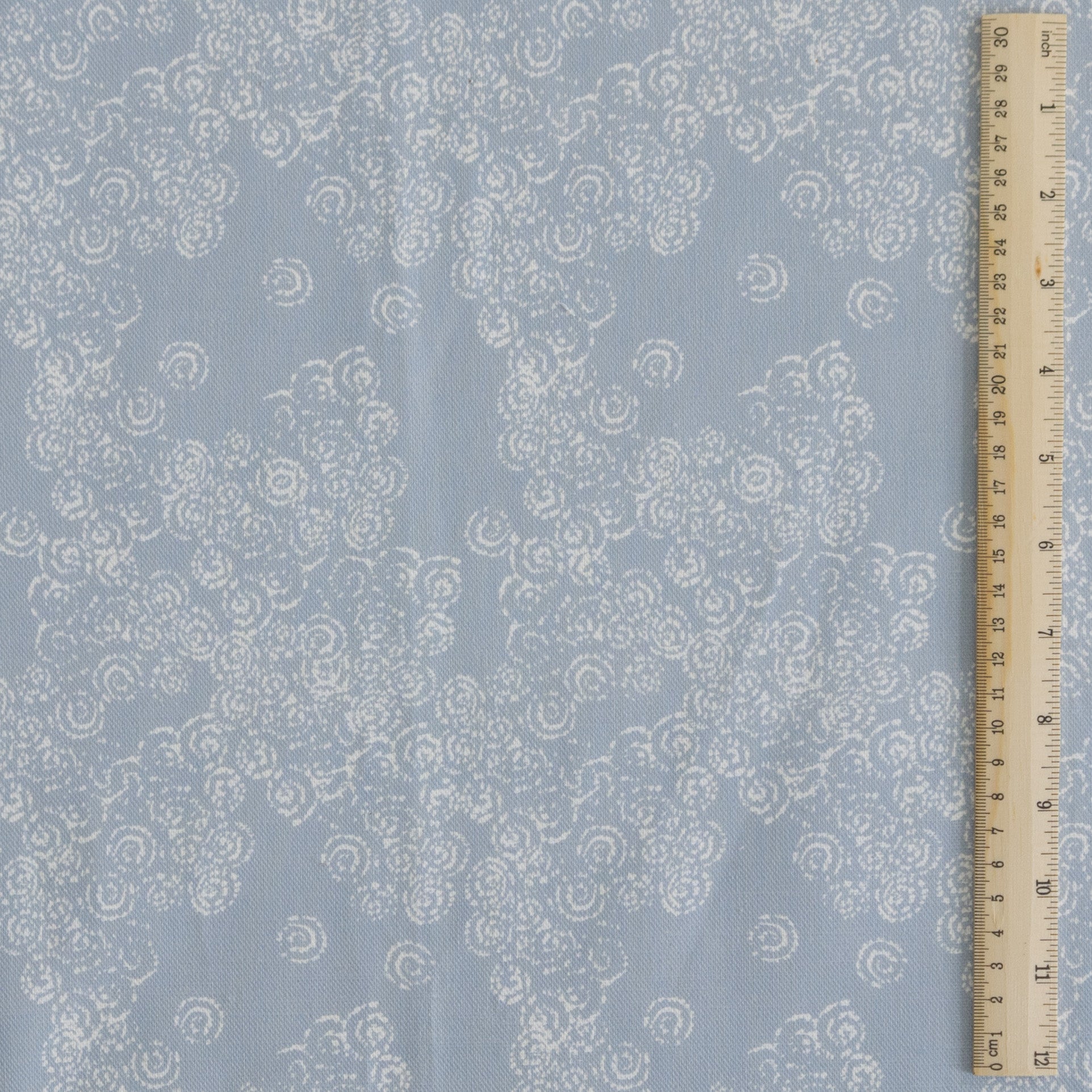 Curls fabric design with ruler for scale