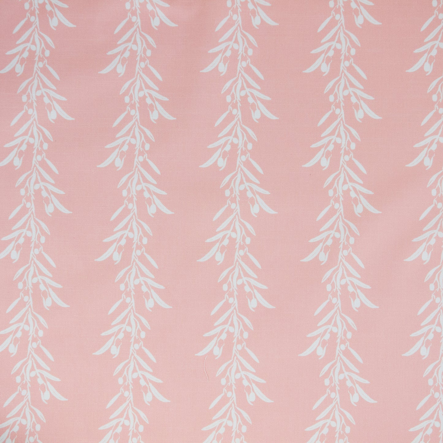 White leaf pattern on a blush coloured background. Fabric suitable for interiors projects