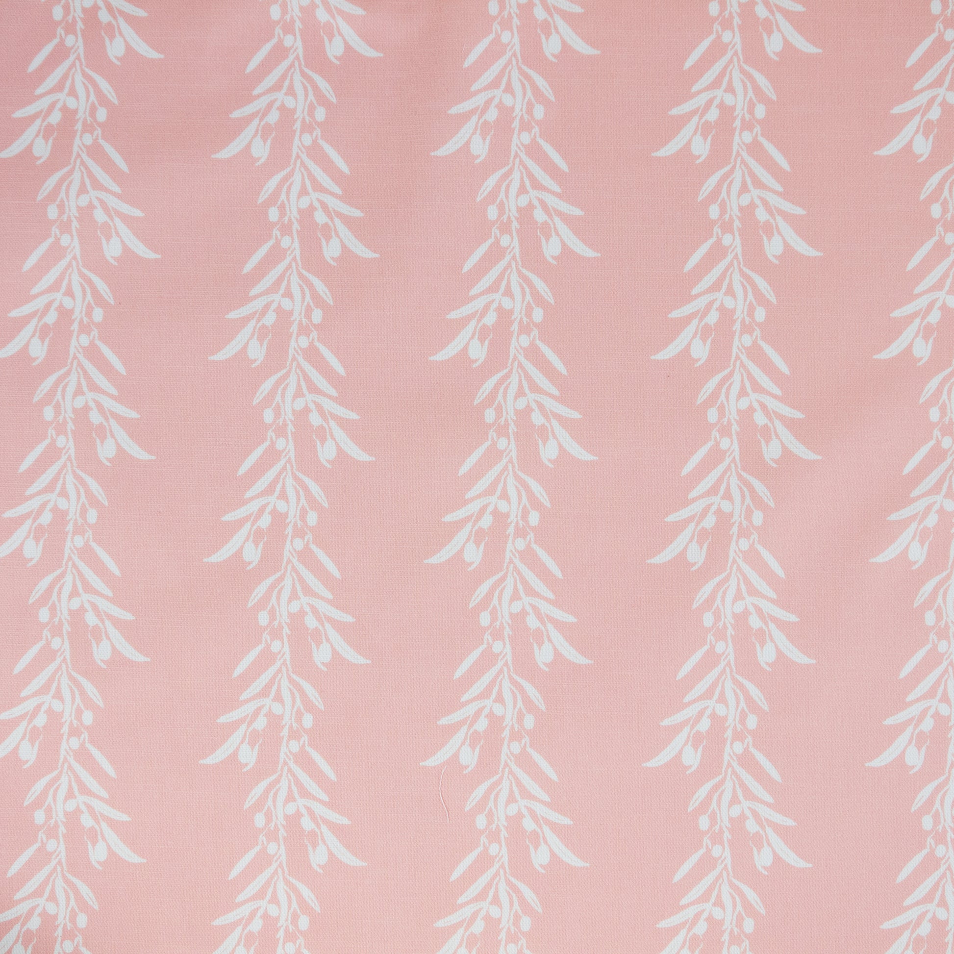 White leaf pattern on a blush coloured background. Fabric suitable for interiors projects