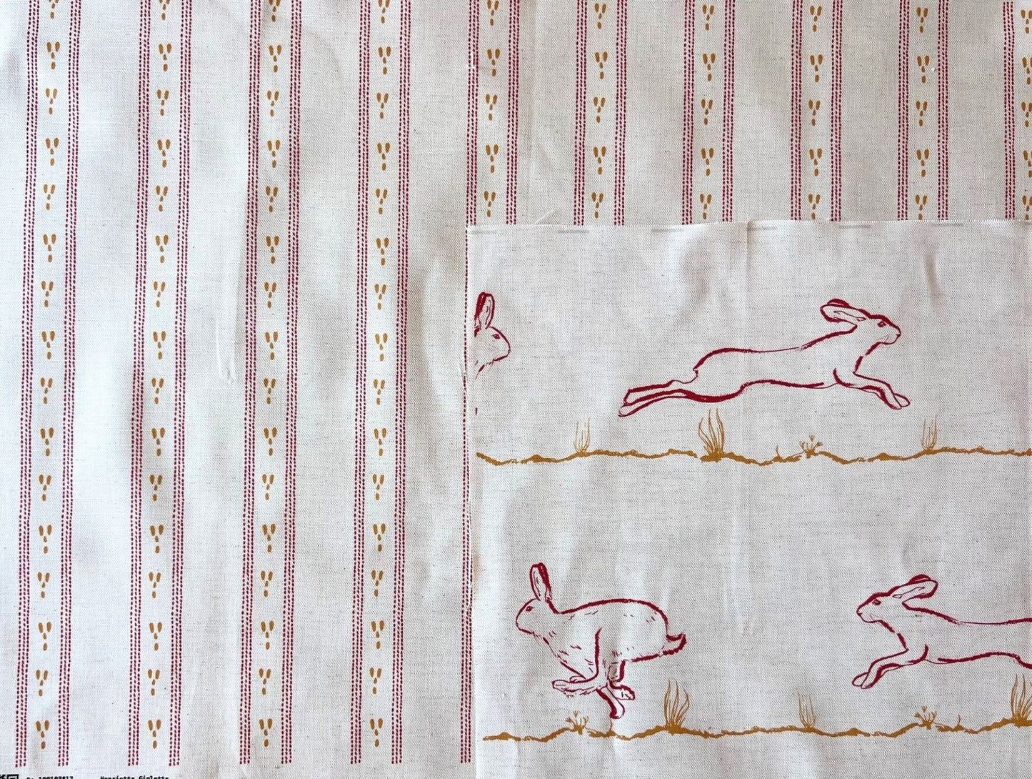 Dashed stripe fabric shown with running hares fabric for interiors. Bespoke colouring options available