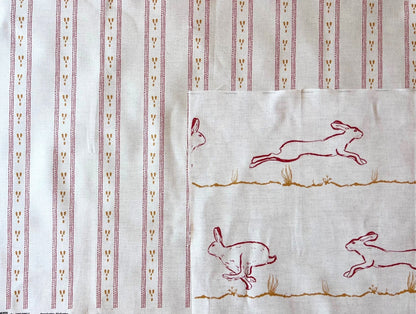 Dashed stripe fabric shown with running hares fabric for interiors. Bespoke colouring options available