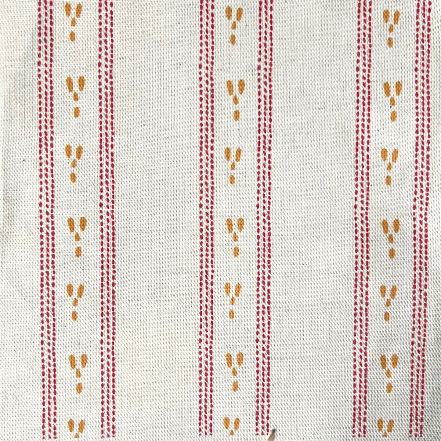 A dashed stripe design printed onto a natural colour fabric base for use in interiors projects