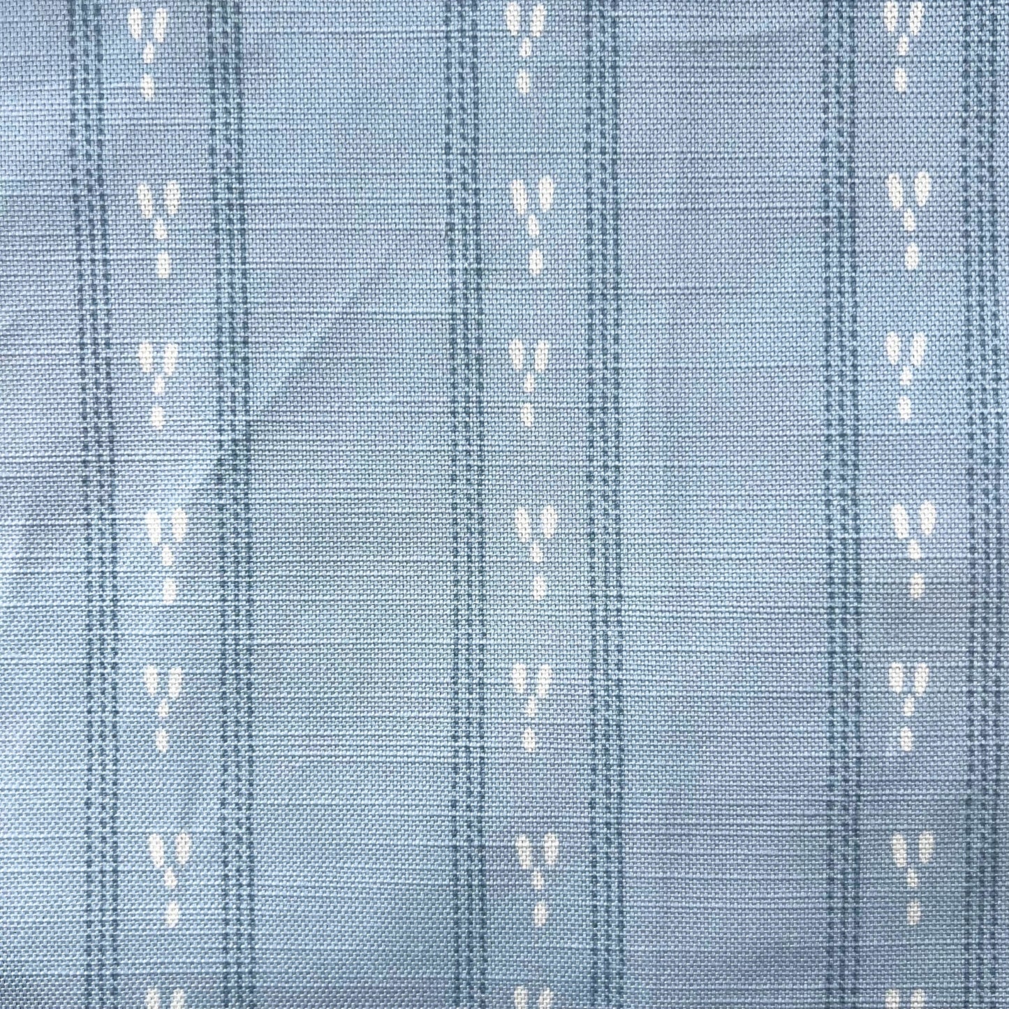 LIght blue furnish fabric with a dashed stripe design for blinds cushions curtains 
