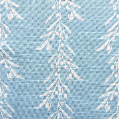 White leaf pattern on a blue fabric background for interior decoration projects